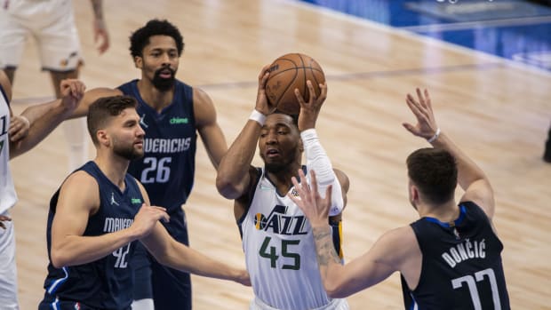 Dallas Mavericks forward Maxi Kleber (42) and guard Luka Doncic (77) defend against Utah Jazz guard Donovan Mitchell (45) during the fourth quarter in game five of the first round for the 2022 NBA playoffs at American Airlines Center.